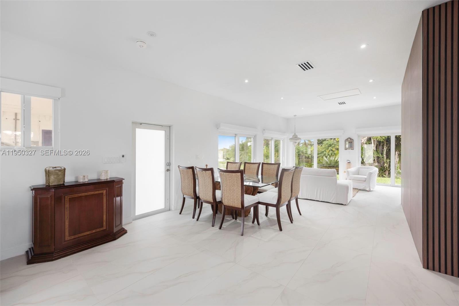 34650 Southwest 218th Avenue Homestead, FL 33034 - Photo 15 of 52 a dining room with furniture and window