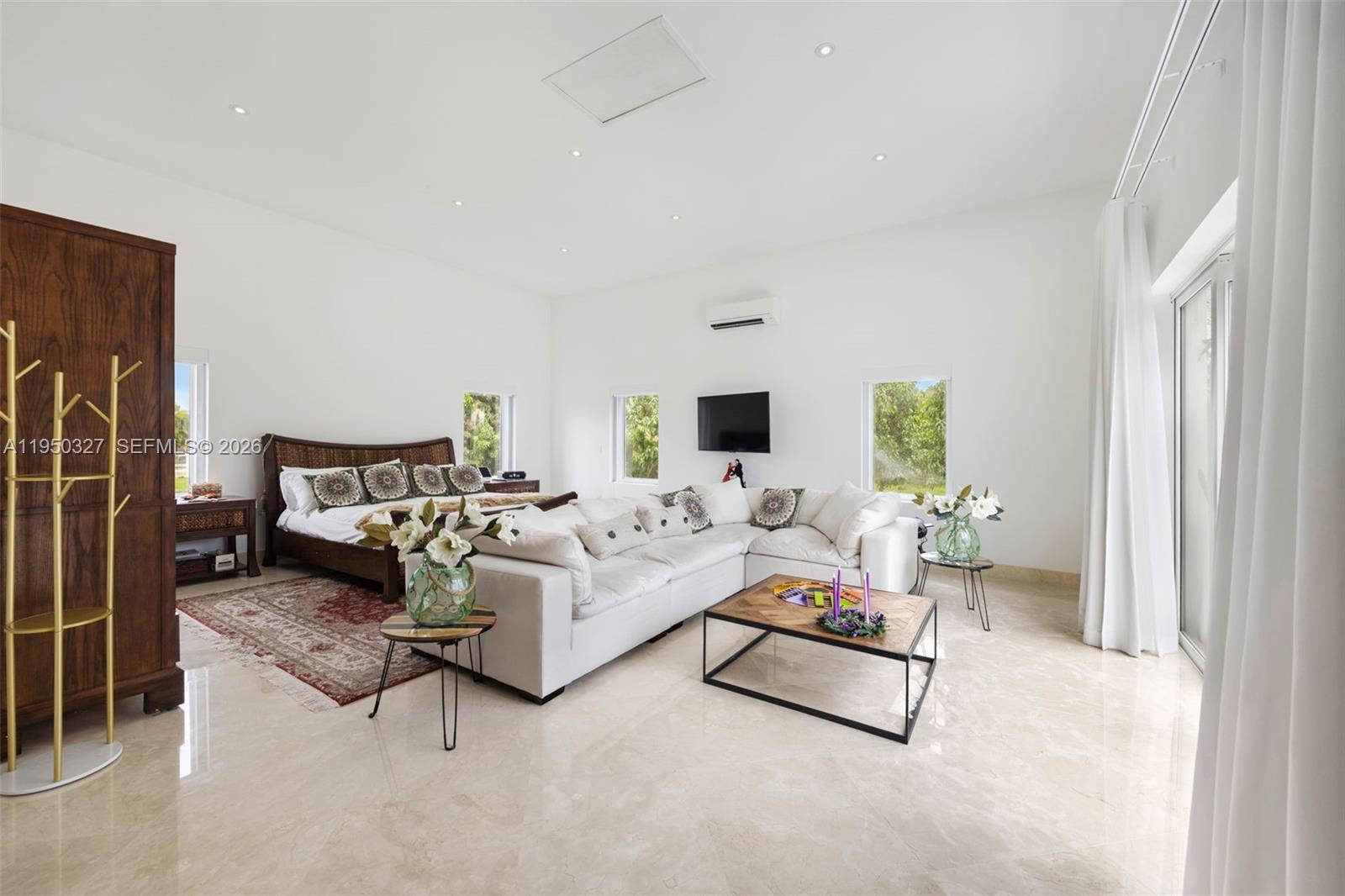 34650 Southwest 218th Avenue Homestead, FL 33034 - Photo 20 of 52 a living room with furniture and a flat screen tv