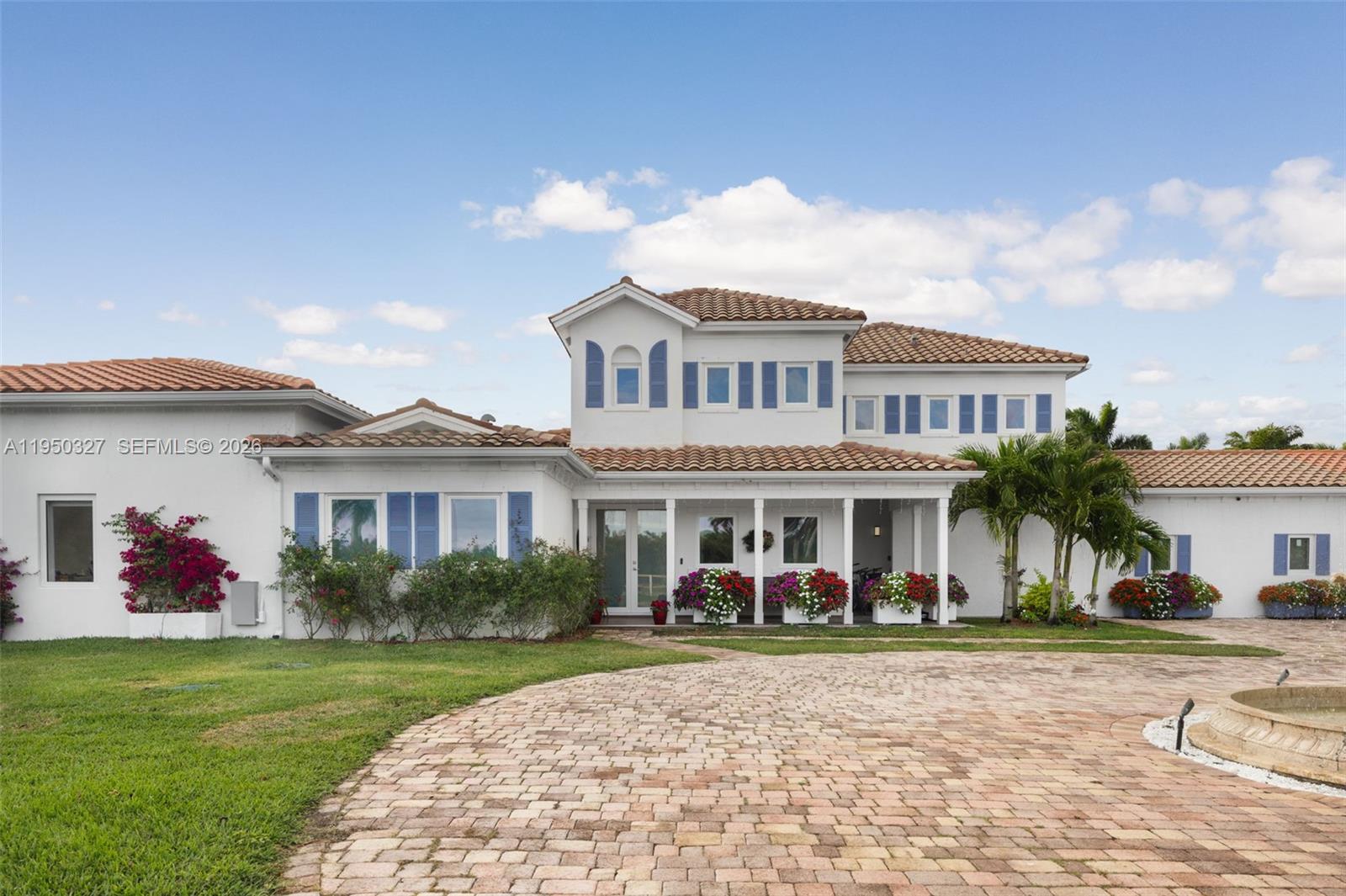 34650 Southwest 218th Avenue Homestead, FL 33034 - Photo 2 of 52 a view of a house with a yard and plants