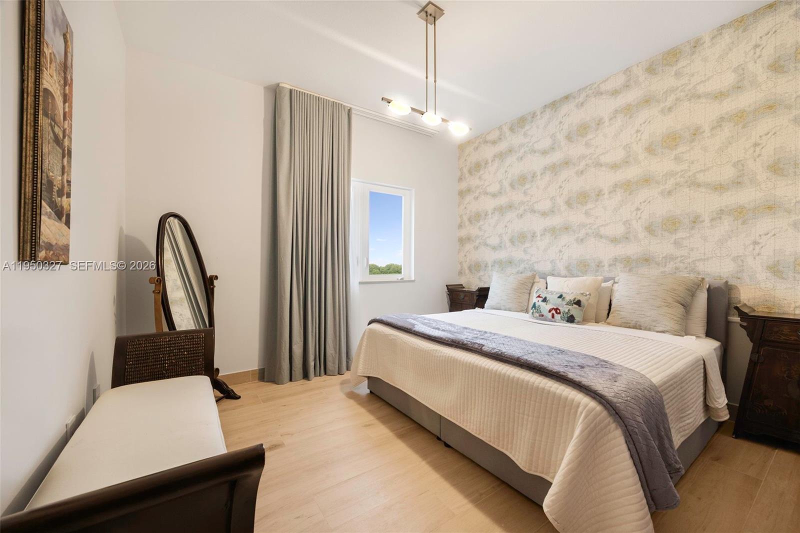 34650 Southwest 218th Avenue Homestead, FL 33034 - Photo 23 of 52 a bedroom with a bed and a dresser