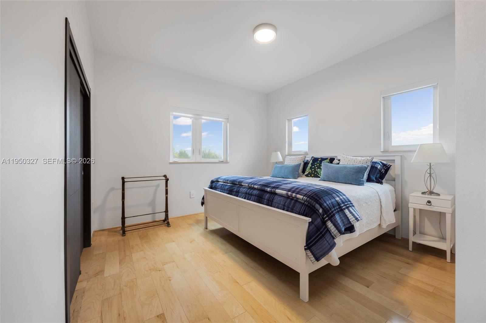 34650 Southwest 218th Avenue Homestead, FL 33034 - Photo 26 of 52 a spacious bedroom with a bed and window