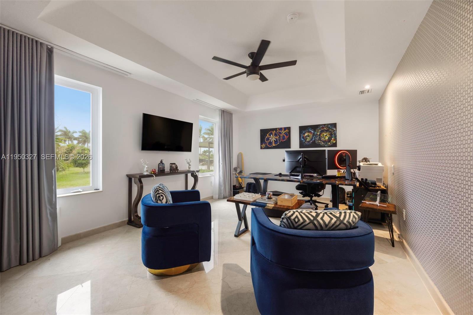 34650 Southwest 218th Avenue Homestead, FL 33034 - Photo 27 of 52 a living room with furniture and a flat screen tv