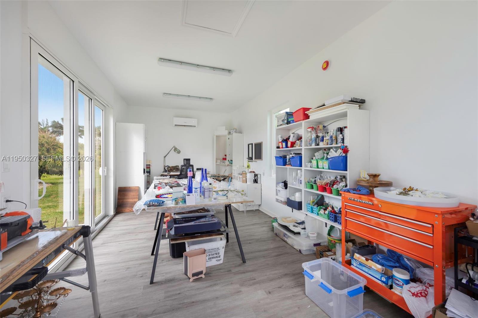 34650 Southwest 218th Avenue Homestead, FL 33034 - Photo 28 of 52 a room with furniture a rug toys and a window