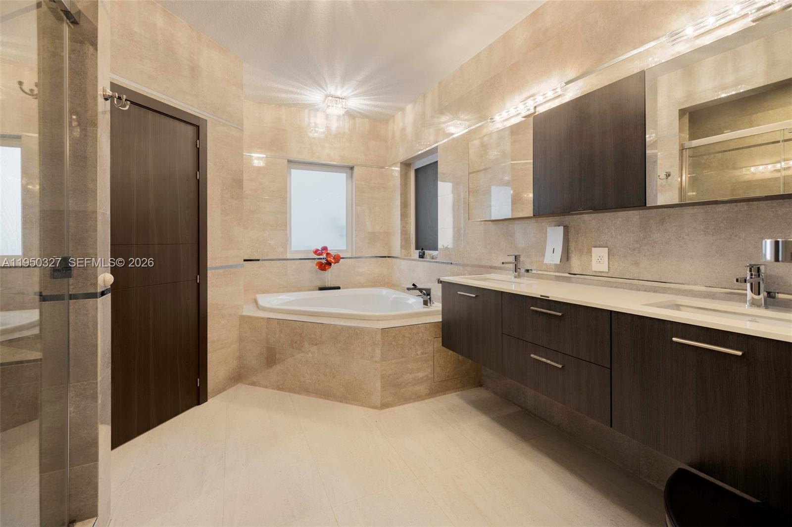 34650 Southwest 218th Avenue Homestead, FL 33034 - Photo 30 of 52 a bathroom with a double vanity sink mirror and toilet