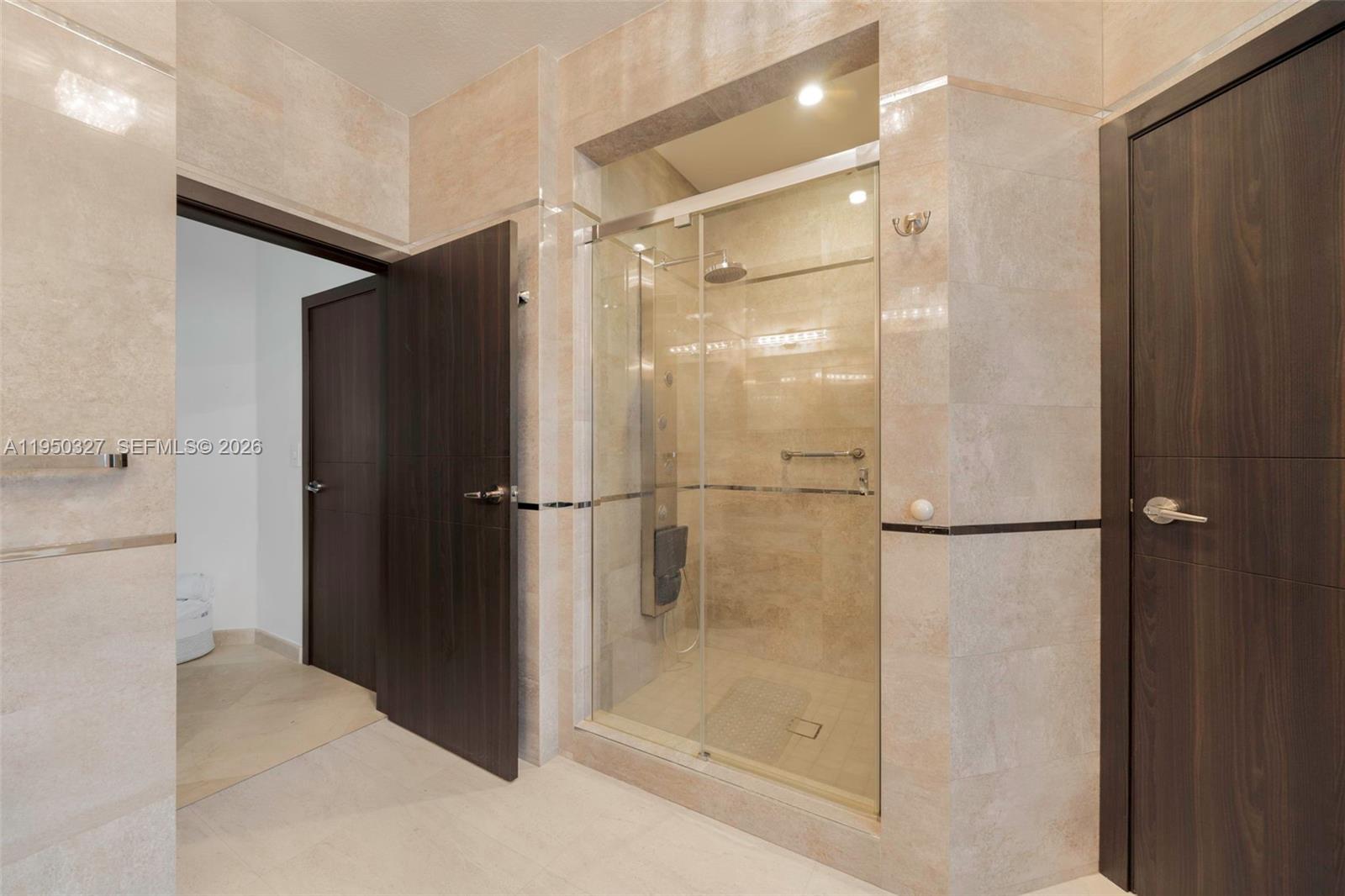 34650 Southwest 218th Avenue Homestead, FL 33034 - Photo 31 of 52 a bathroom with a glass shower door and a sink