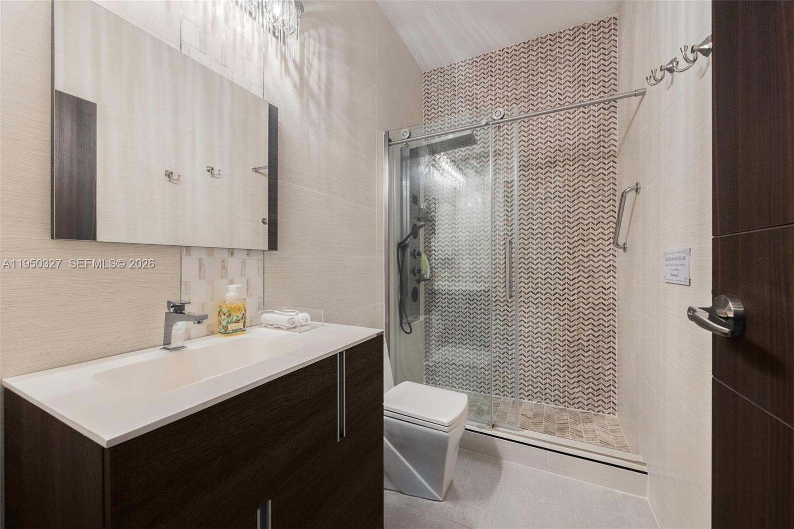 34650 Southwest 218th Avenue Homestead, FL 33034 - Photo 33 of 52 a bathroom with a sink toilet and shower