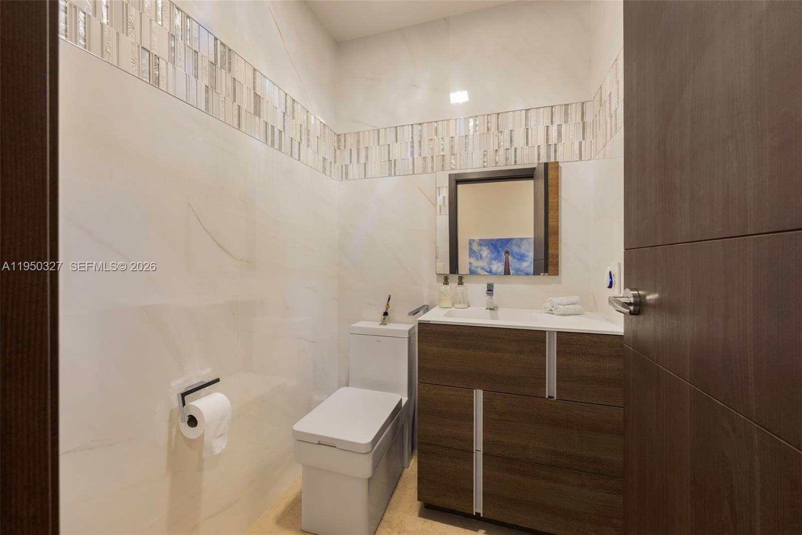 34650 Southwest 218th Avenue Homestead, FL 33034 - Photo 35 of 52 a bathroom with a sink toilet and mirror