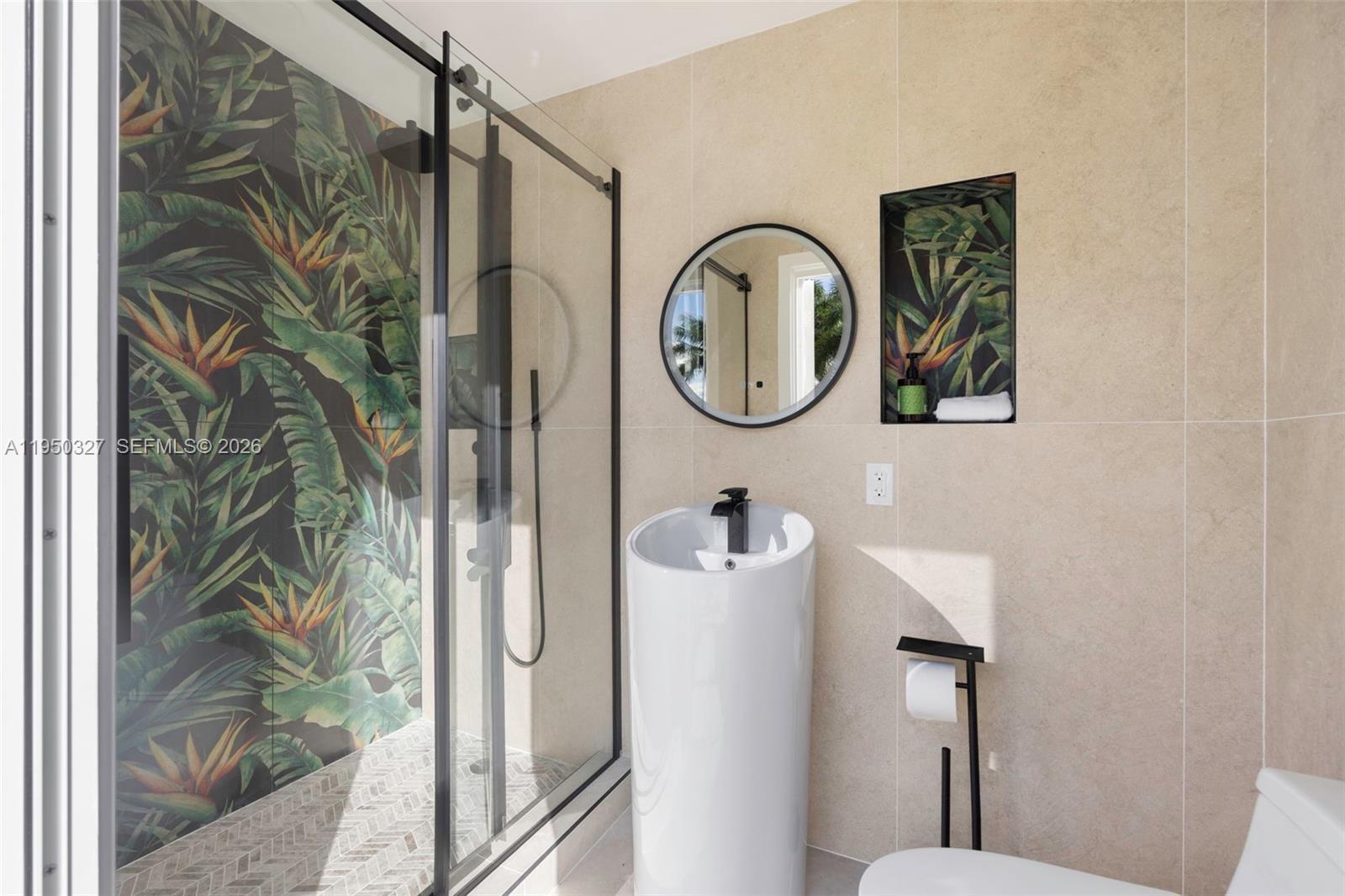 34650 Southwest 218th Avenue Homestead, FL 33034 - Photo 36 of 52 a bathroom with a toilet and a shower curtain