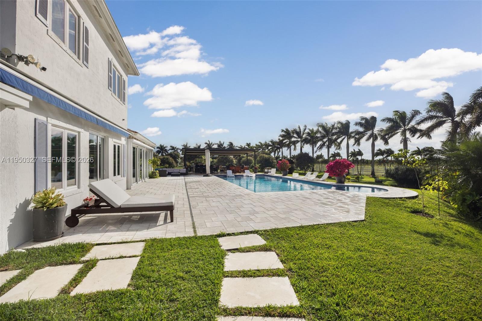 34650 Southwest 218th Avenue Homestead, FL 33034 - Photo 37 of 52 a view of a backyard with sitting area
