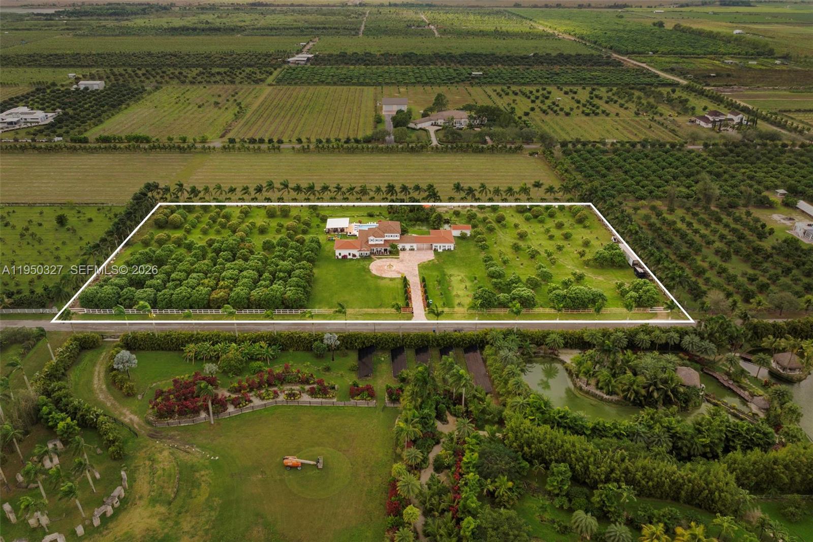 34650 Southwest 218th Avenue Homestead, FL 33034 - Photo 48 of 52 a view of a swimming pool with a lake