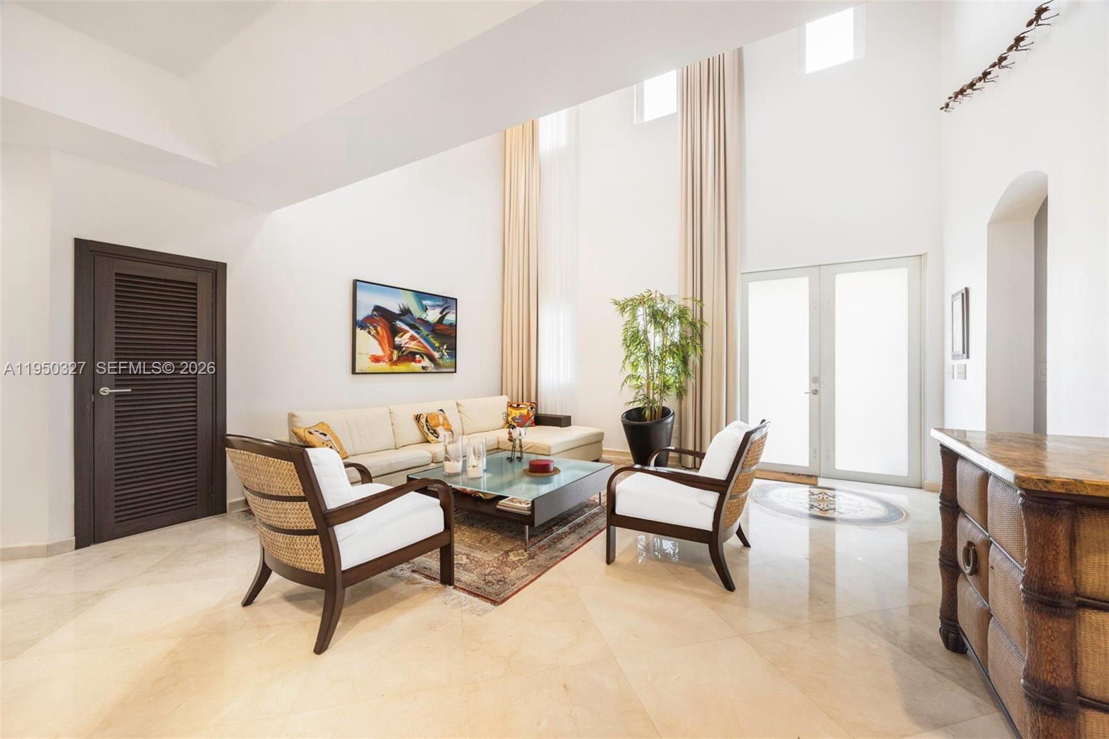 34650 Southwest 218th Avenue Homestead, FL 33034 - Photo 5 of 52 a living room with furniture and a window