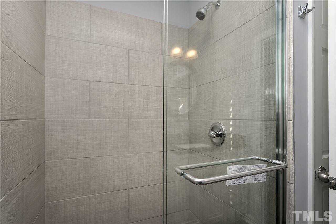 2016 Howson Road Raleigh, NC 27603 - Photo 18 of 25 a bathroom with a shower and a sink