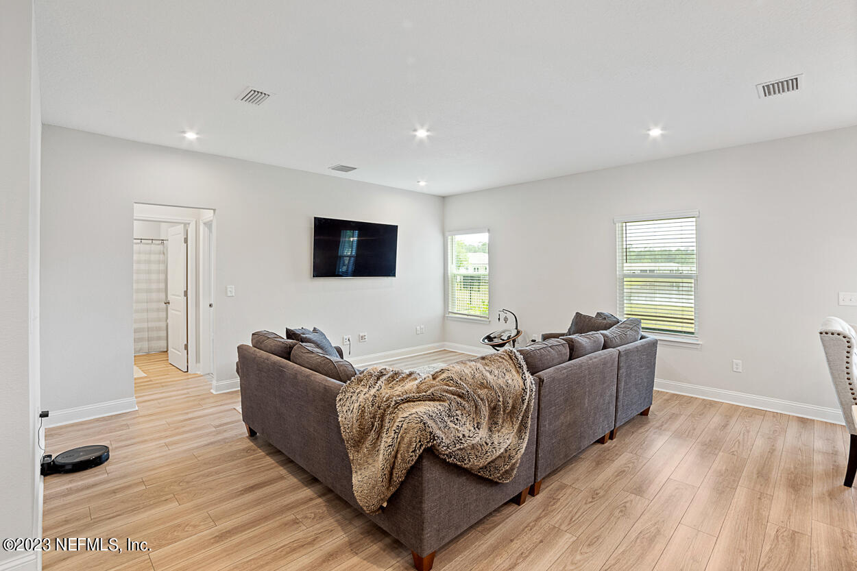 13186 Dunwick Road Jacksonville, FL 32256 - Photo 13 of 48 a living room with furniture and a flat screen tv