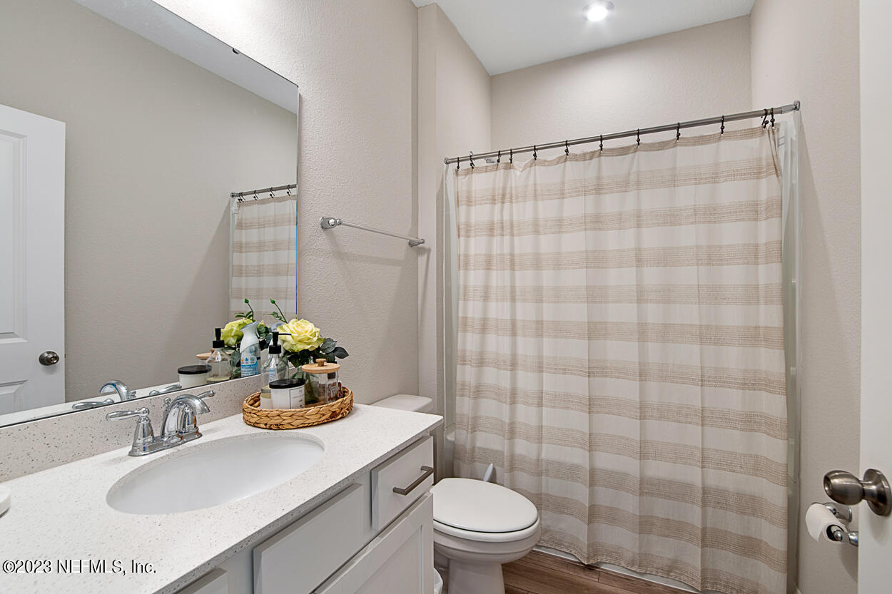 13186 Dunwick Road Jacksonville, FL 32256 - Photo 16 of 48 a bathroom with a sink toilet and shower