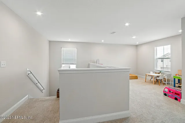 a view of storage and utility room with windows