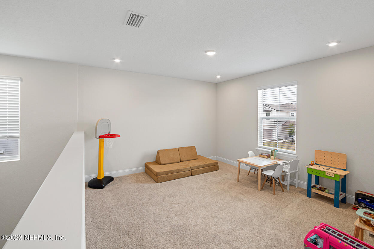 13186 Dunwick Road Jacksonville, FL 32256 - Photo 19 of 48 a living room with furniture and a window