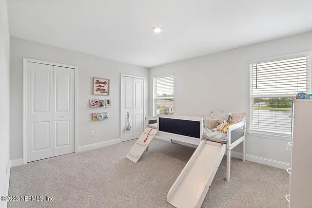 a bathroom with 2 sink and a mirror