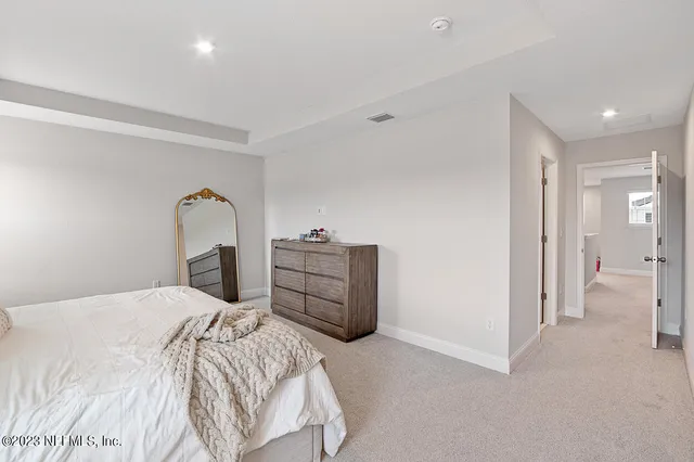 a bedroom with a bed and a closet