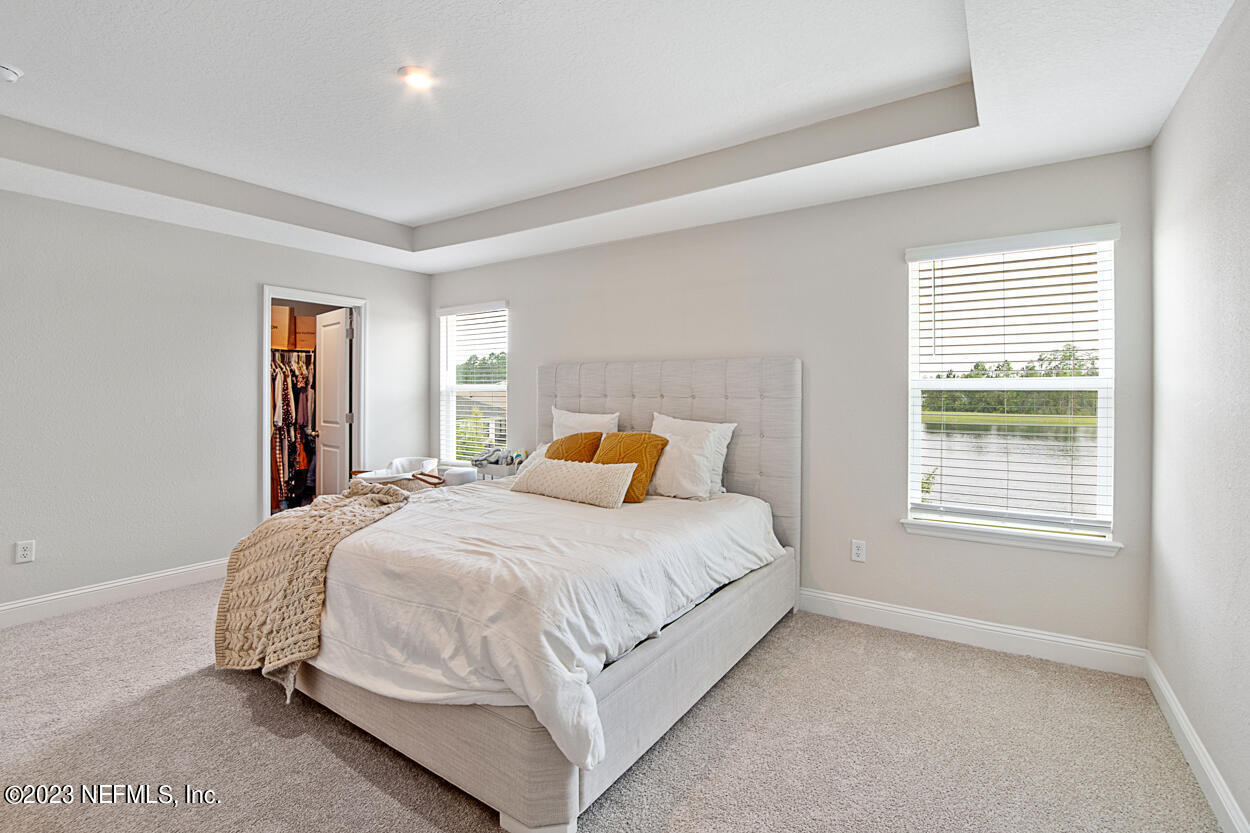 13186 Dunwick Road Jacksonville, FL 32256 - Photo 29 of 48 a bedroom with a bed and a closet