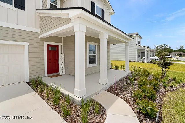 a front view of a house with a outdoor space