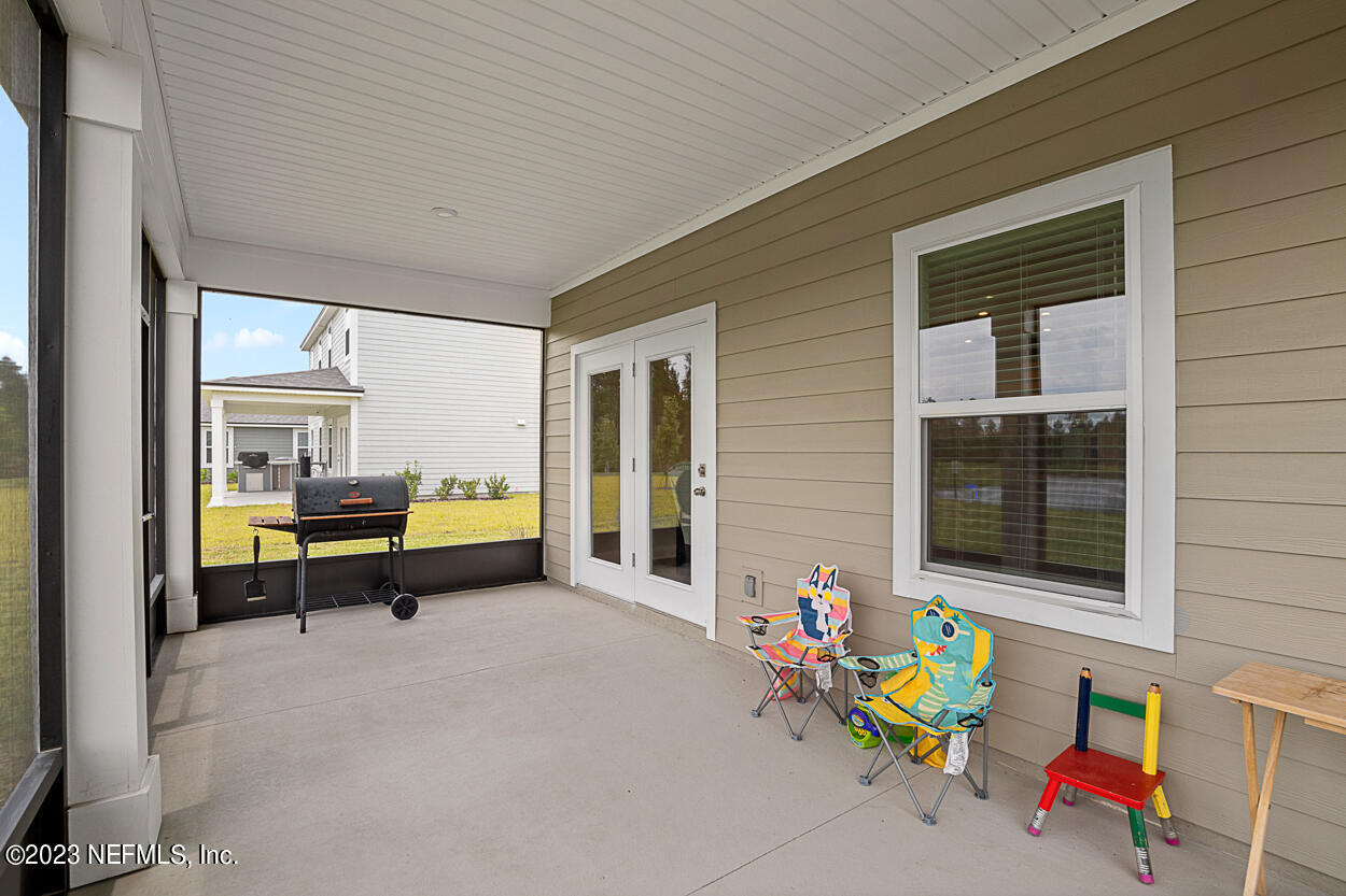 13186 Dunwick Road Jacksonville, FL 32256 - Photo 32 of 48 a swimming pool with outdoor seating