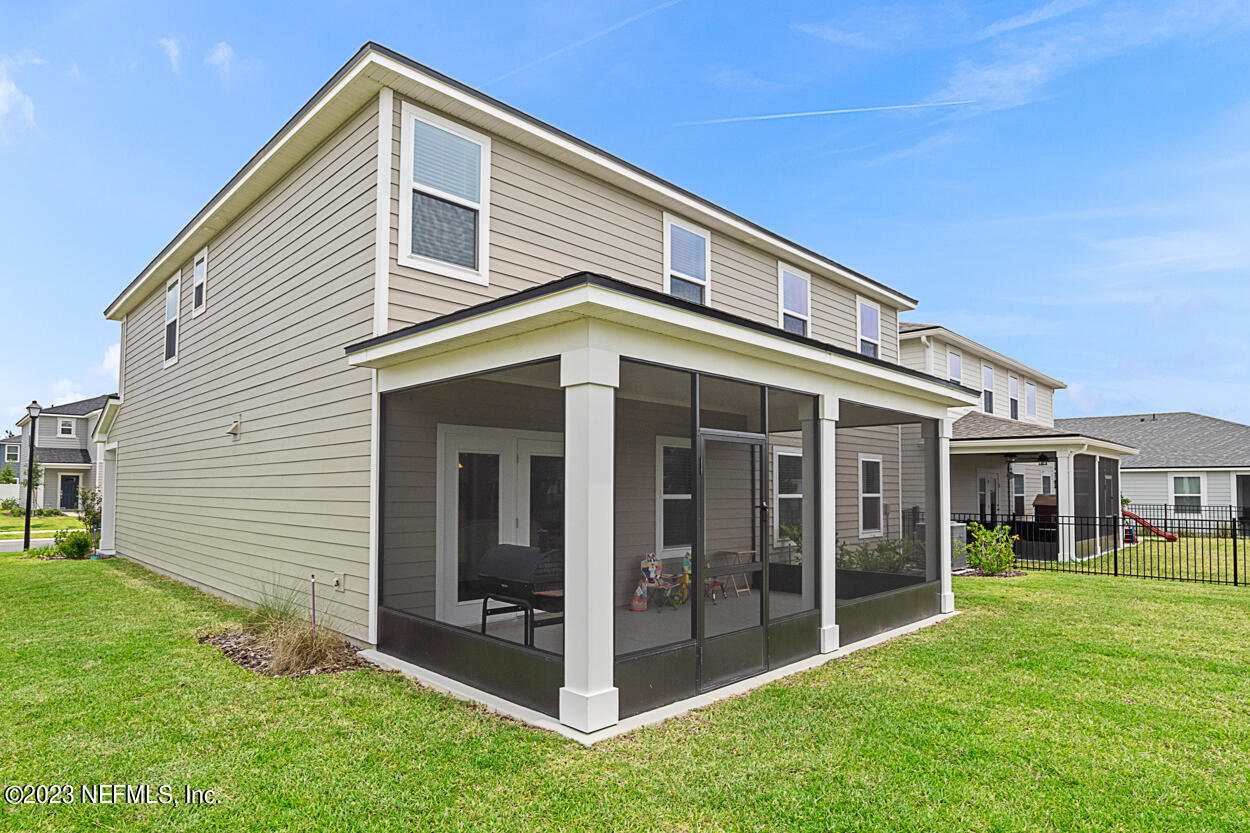 13186 Dunwick Road Jacksonville, FL 32256 - Photo 33 of 48 a front view of a house with a yard