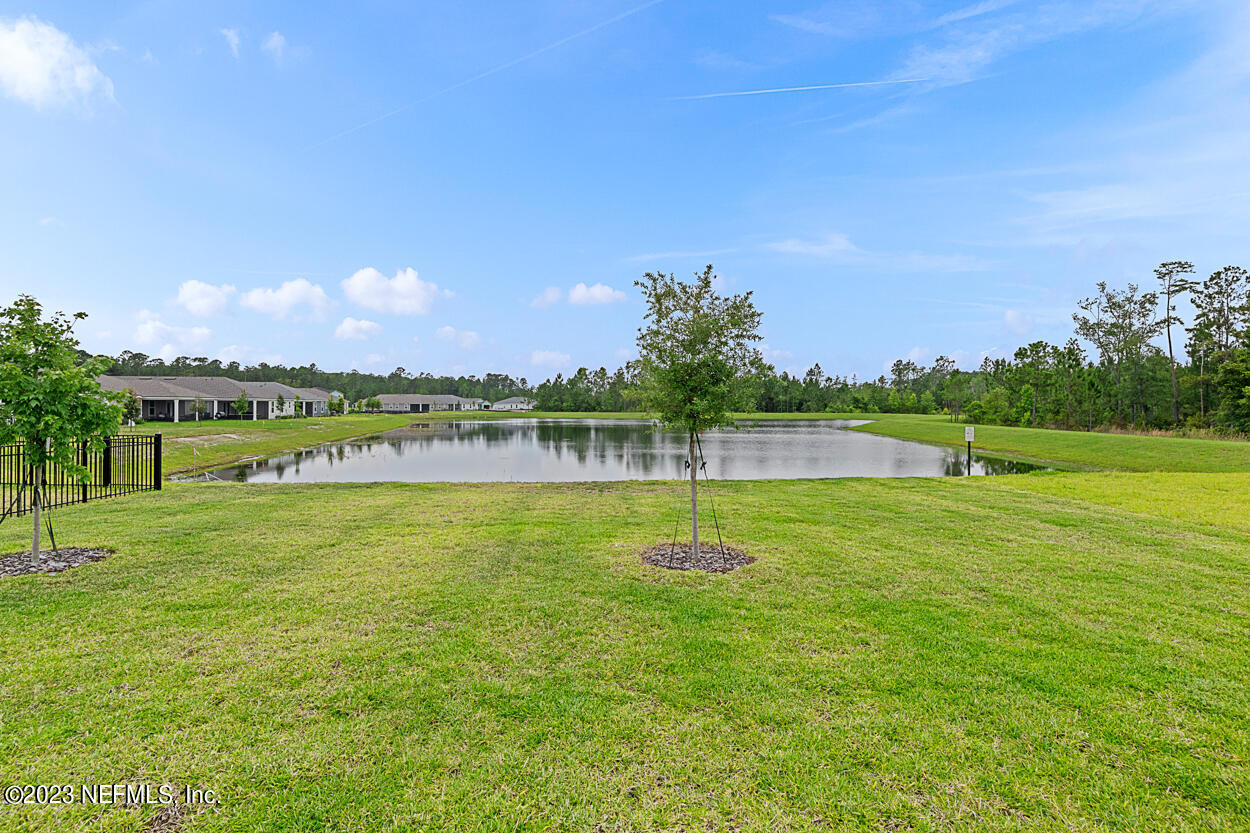 13186 Dunwick Road Jacksonville, FL 32256 - Photo 36 of 48 a view of a golf course with a lake