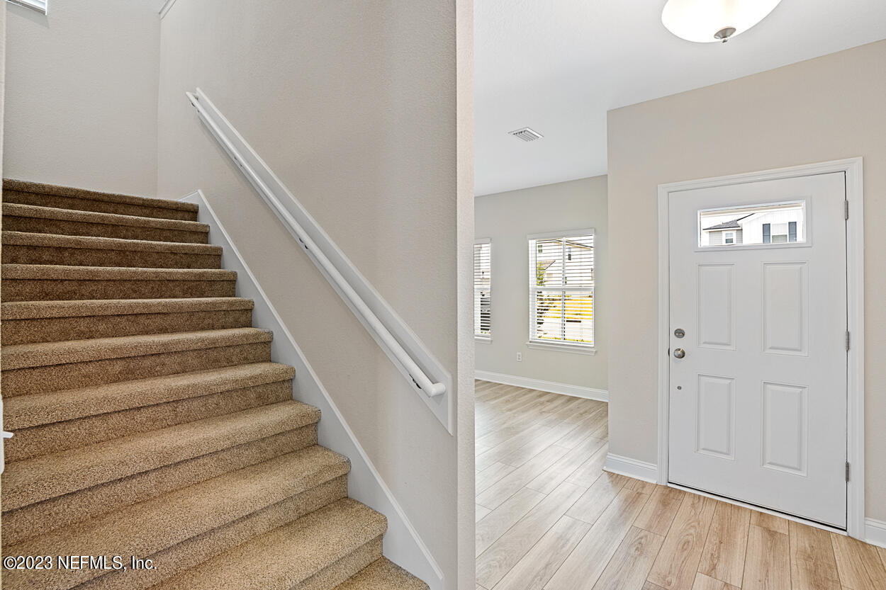 13186 Dunwick Road Jacksonville, FL 32256 - Photo 4 of 48 a view of an entryway with wooden floor