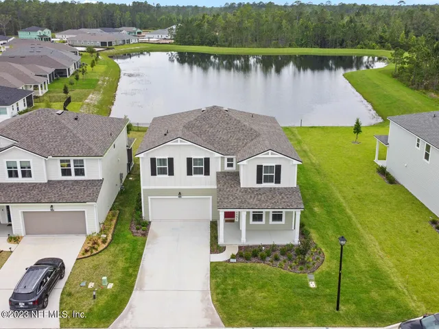 an aerial view of a house with a garden