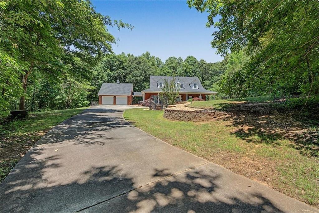 1136 Cole Lake Road Dallas, GA 30157 - Photo 4 of 72 a view of a house with a yard and tree s