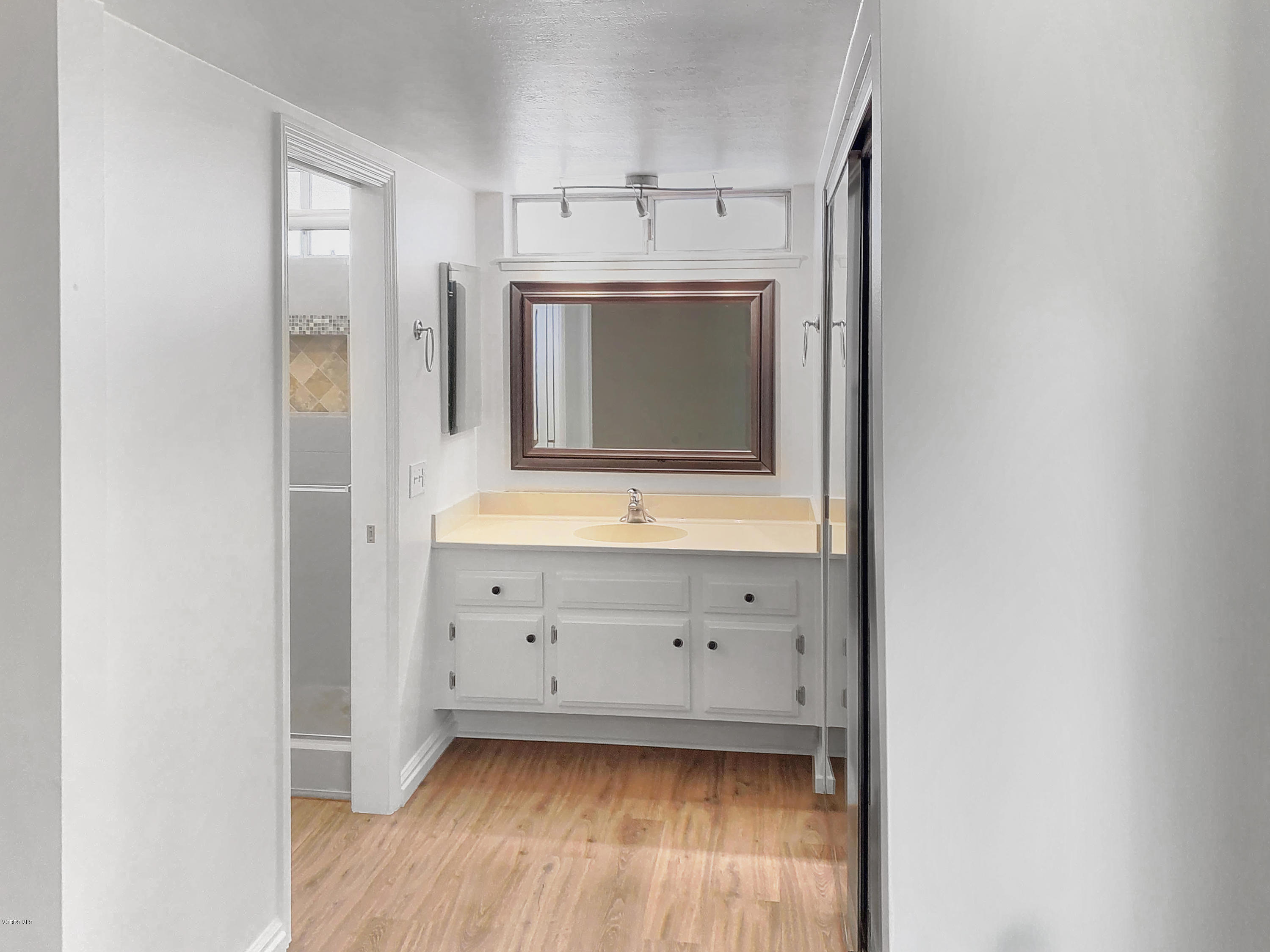 29407 Promontory Place Agoura Hills, CA 91301 - Photo 12 of 26 a bathroom with a sink and a mirror