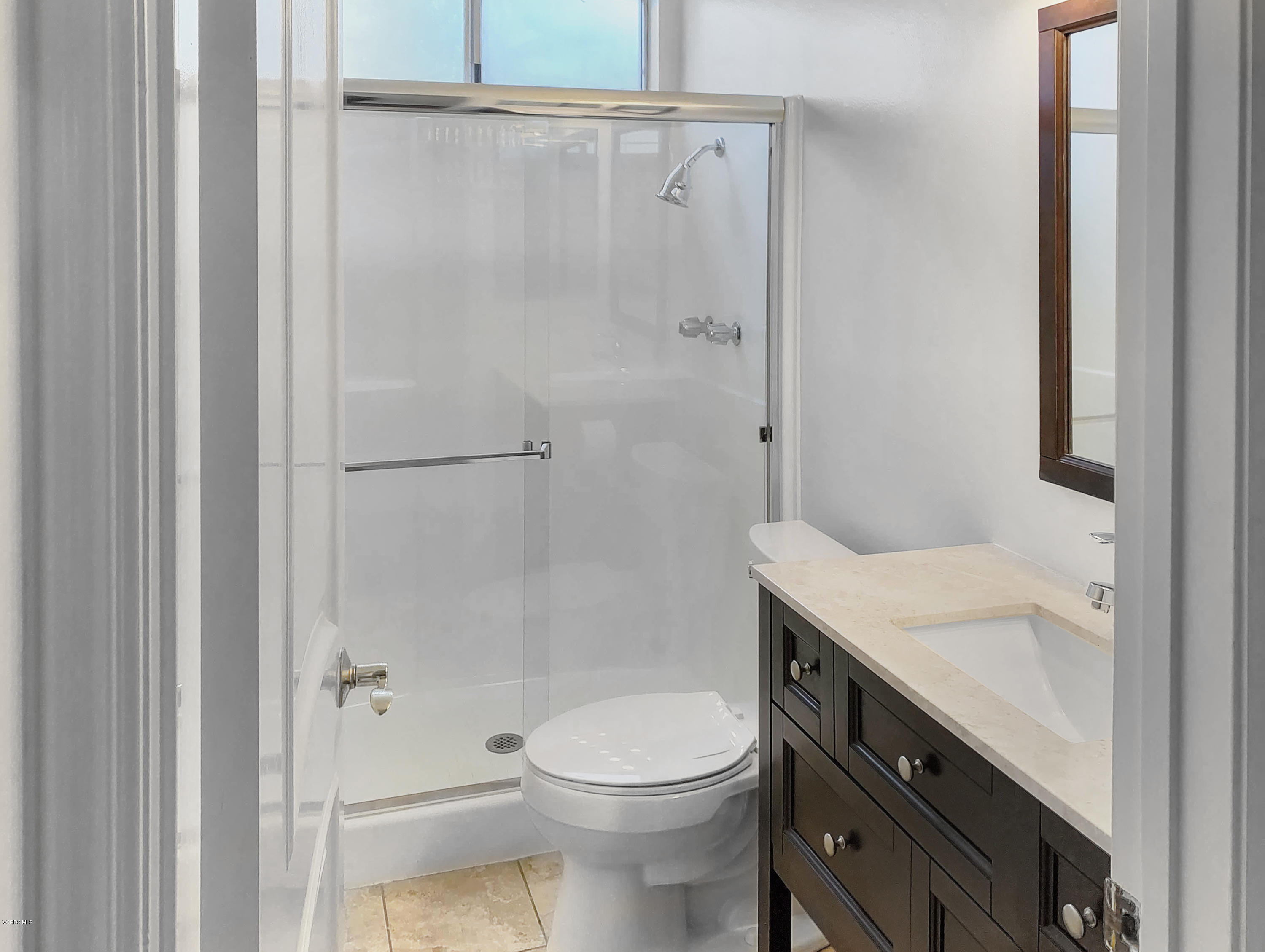 29407 Promontory Place Agoura Hills, CA 91301 - Photo 18 of 26 a bathroom with a granite countertop sink toilet and shower