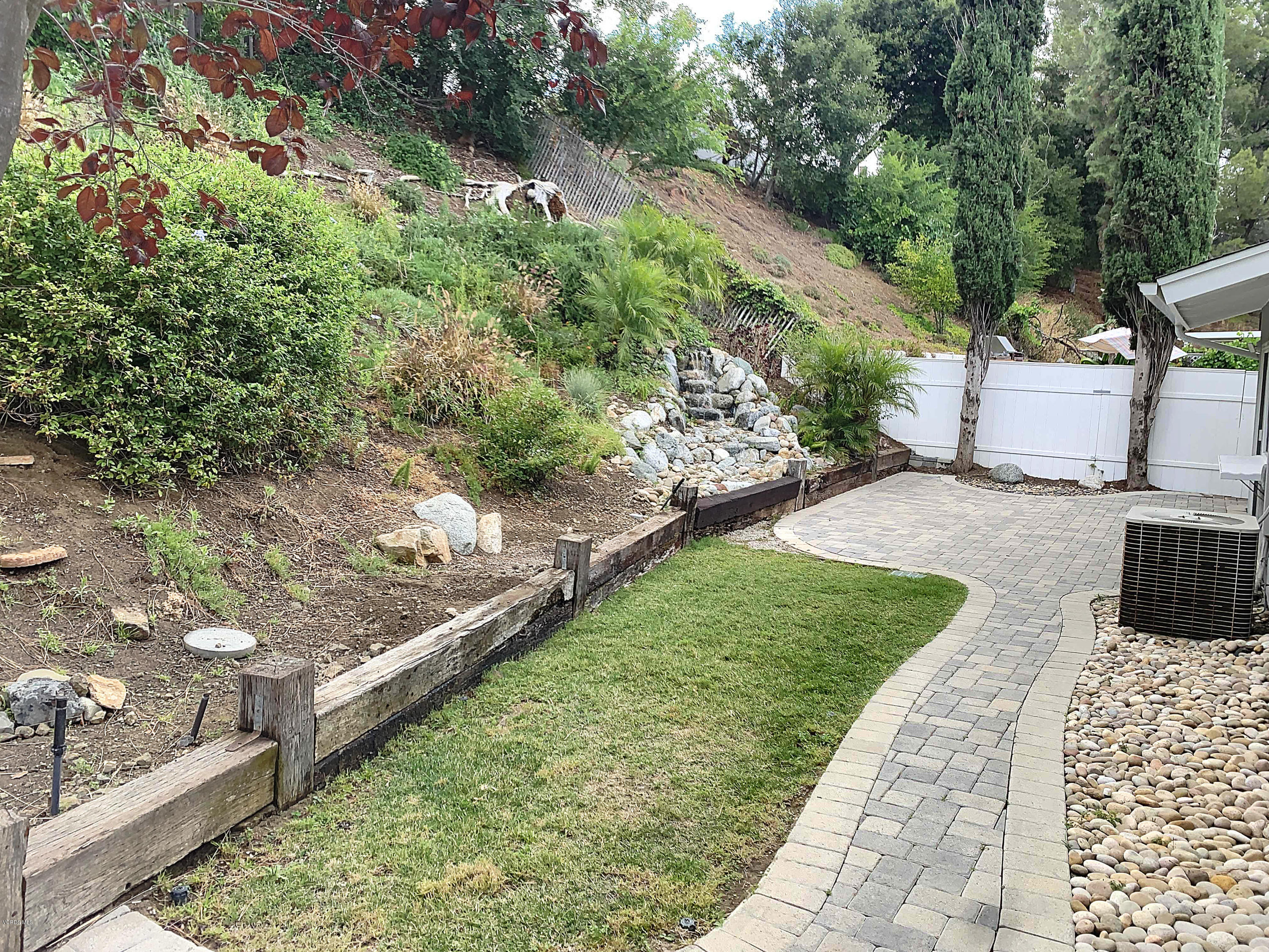 29407 Promontory Place Agoura Hills, CA 91301 - Photo 20 of 26 a view of a backyard with sitting area
