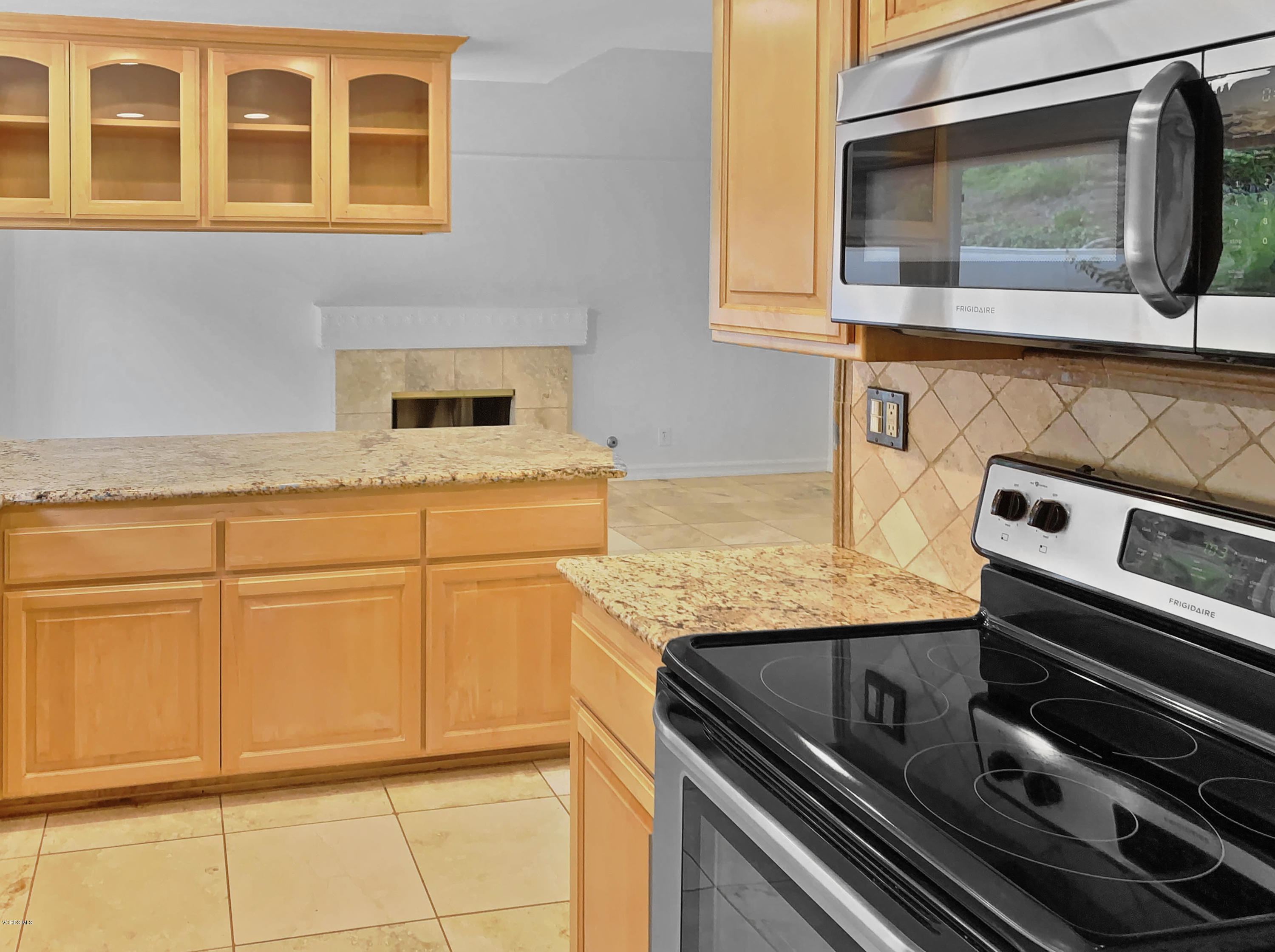 29407 Promontory Place Agoura Hills, CA 91301 - Photo 5 of 26 a kitchen with granite countertop cabinets stainless steel appliances and wooden floor