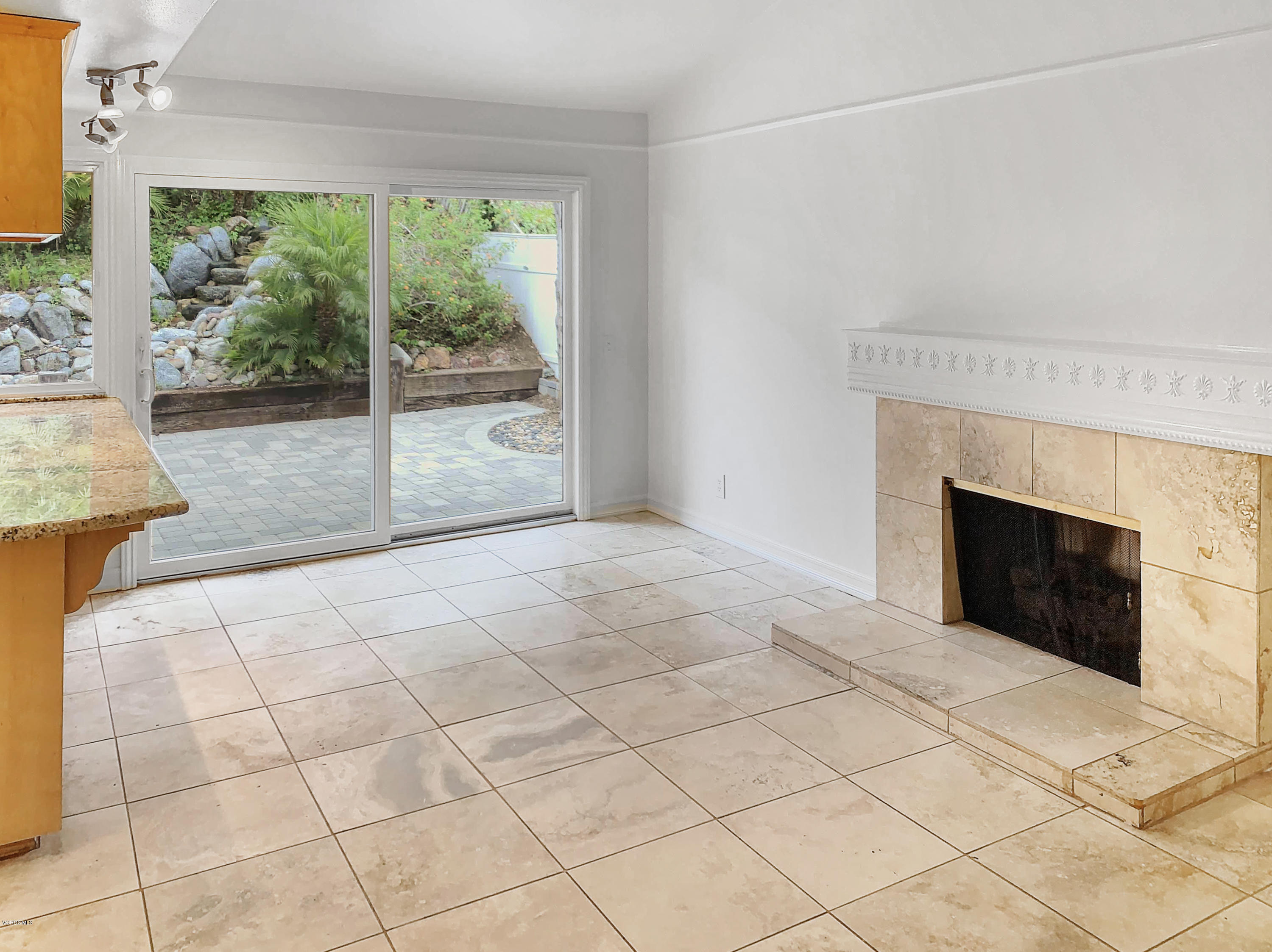 29407 Promontory Place Agoura Hills, CA 91301 - Photo 6 of 26 a view of an empty room with a fireplace and a large window