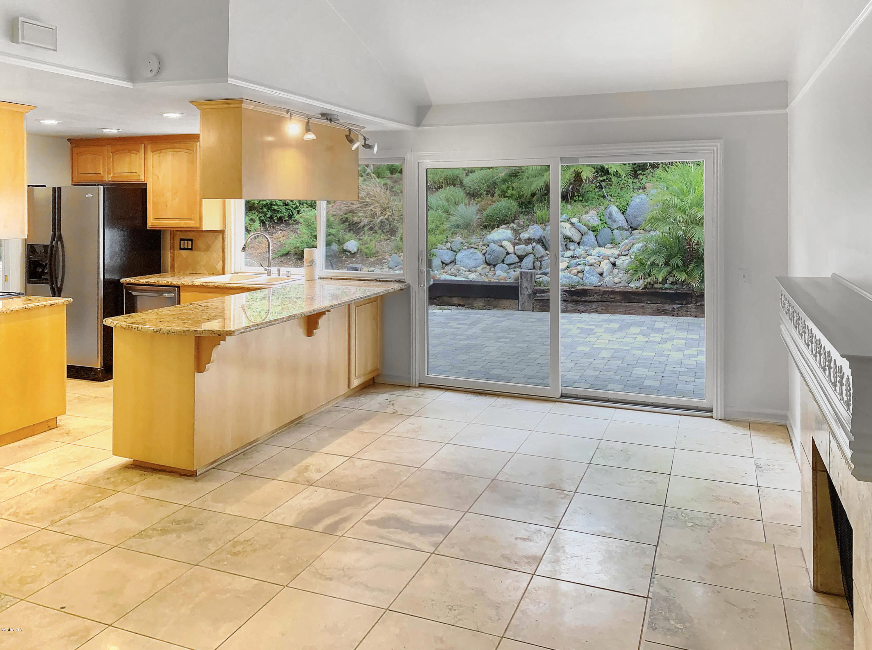 29407 Promontory Place Agoura Hills, CA 91301 - Photo 7 of 26 a large kitchen with granite countertop a large window and a counter top space