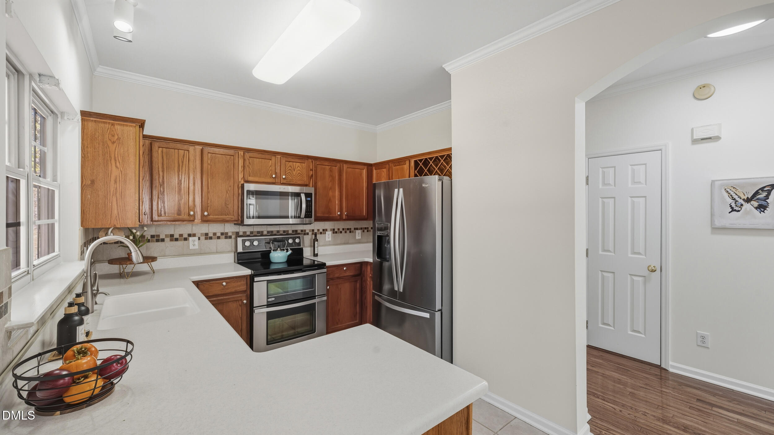 8005 Mill Bluff Court Raleigh, NC 27616 - Photo 13 of 47 Kitchen leading to half bath and laundry room.