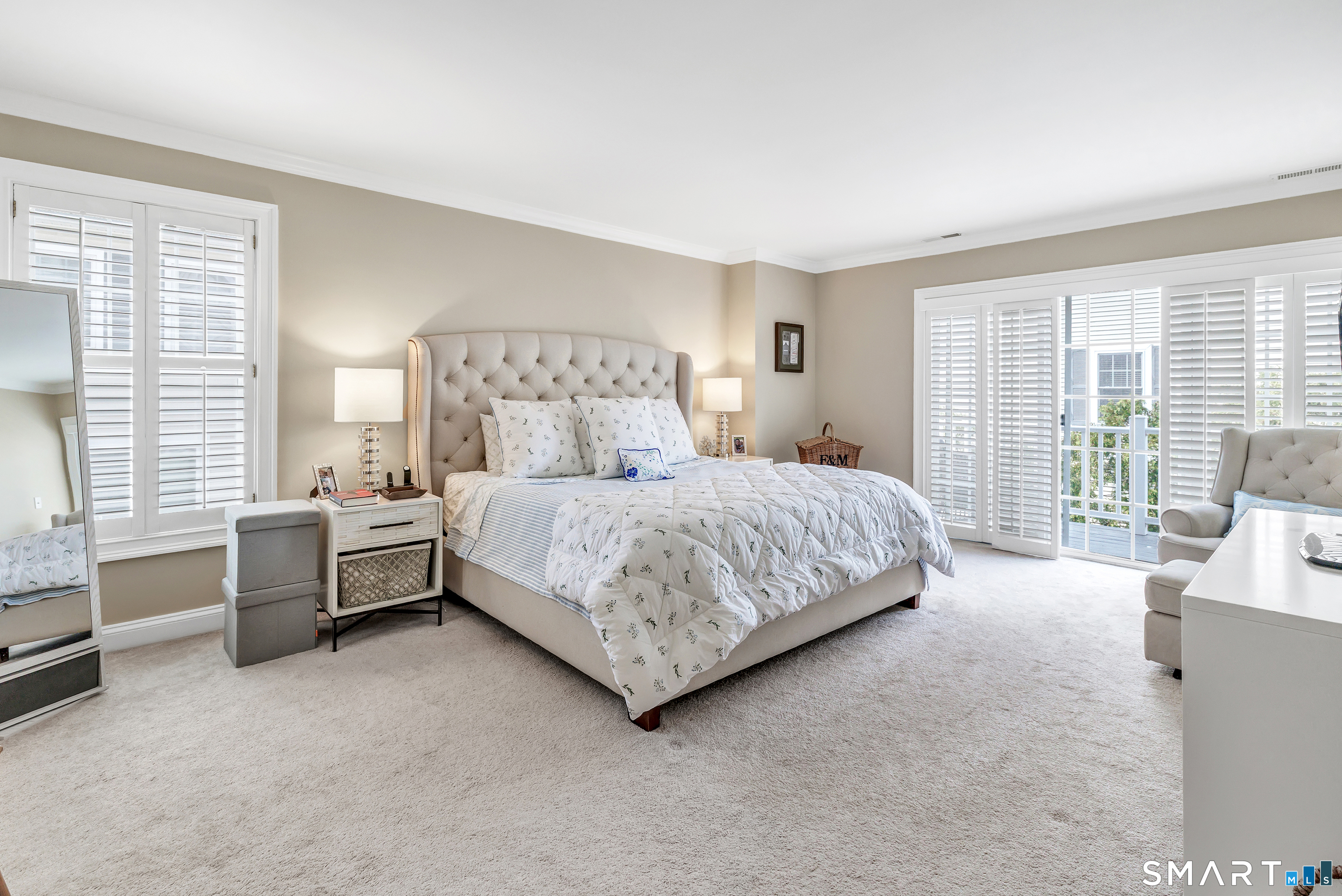 39 Maple Tree Avenue, Unit 15 Stamford, CT 06906 - Photo 11 of 32 a bedroom with a bed and a couch