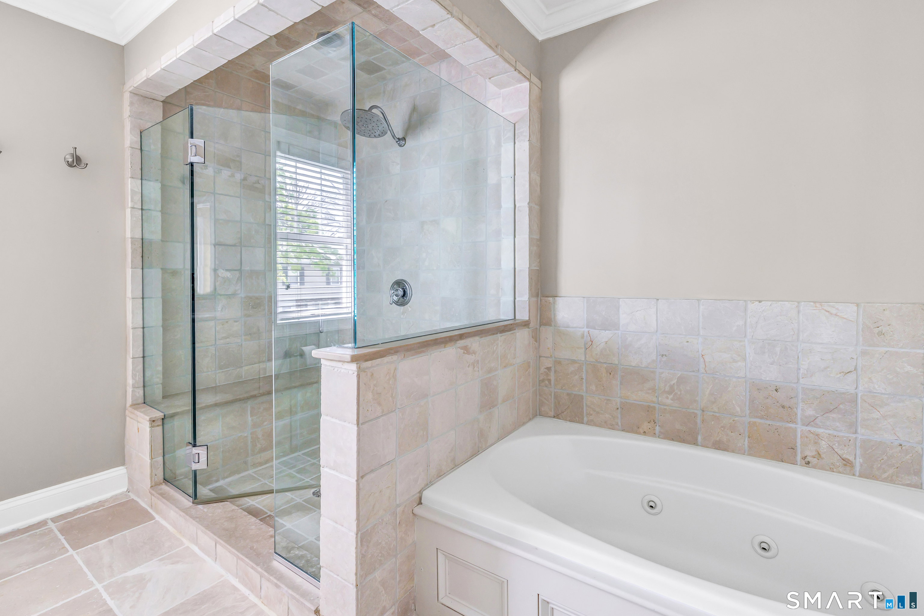39 Maple Tree Avenue, Unit 15 Stamford, CT 06906 - Photo 14 of 32 a bathroom with a bathtub and a shower