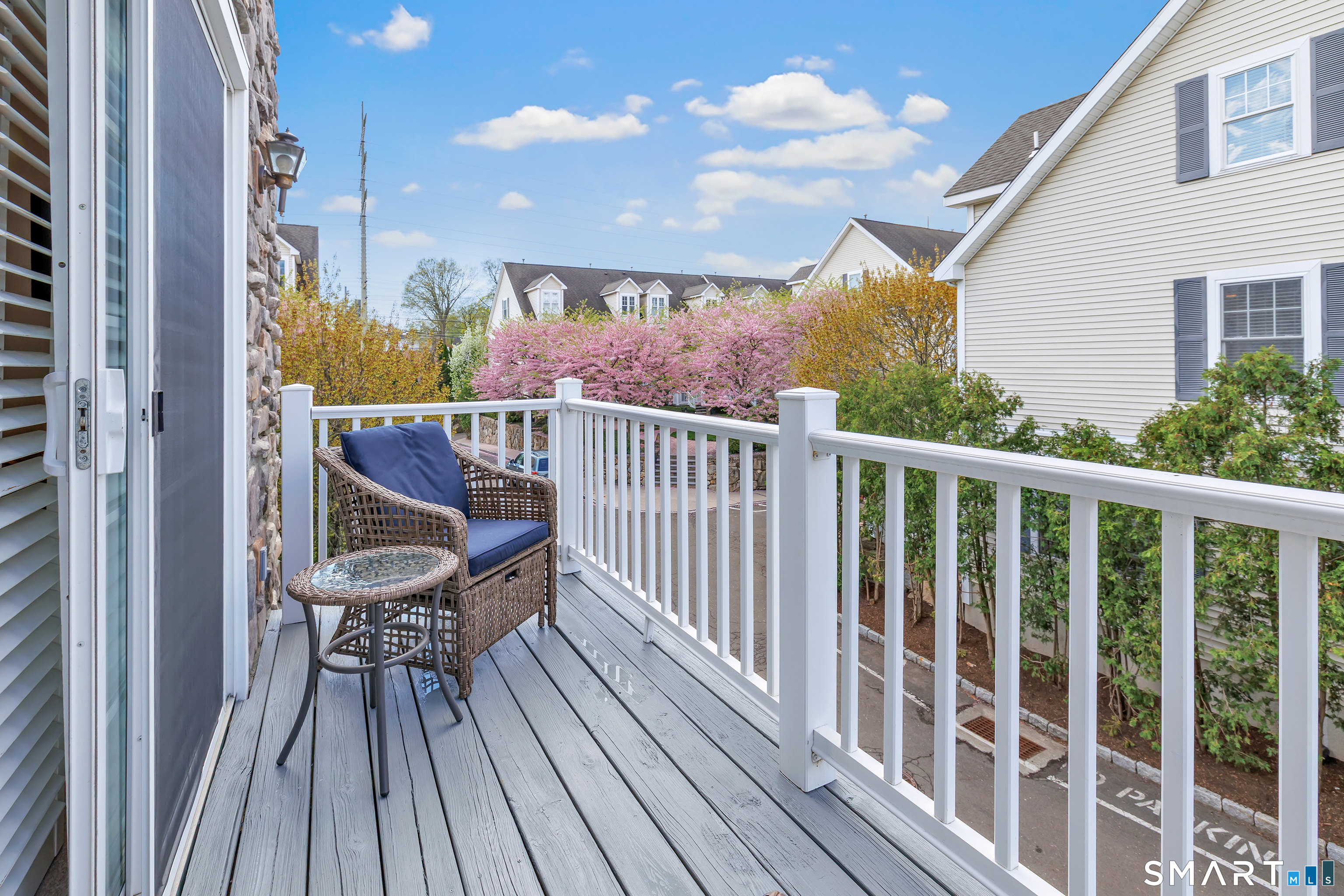 39 Maple Tree Avenue, Unit 15 Stamford, CT 06906 - Photo 15 of 32 a view of balcony with wooden floor and outdoor seating