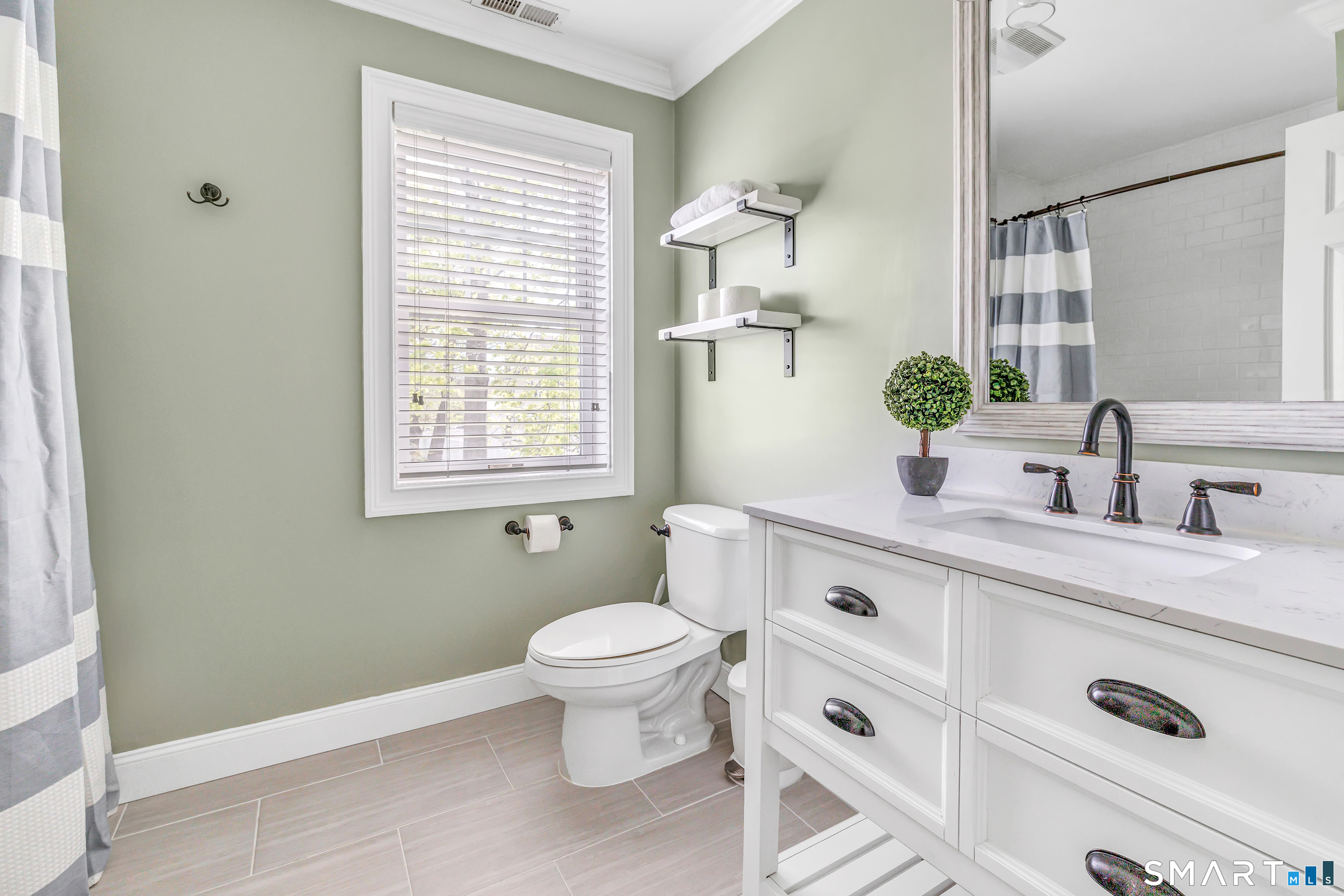 39 Maple Tree Avenue, Unit 15 Stamford, CT 06906 - Photo 17 of 32 a spacious bathroom with a double vanity sink a mirror and a window