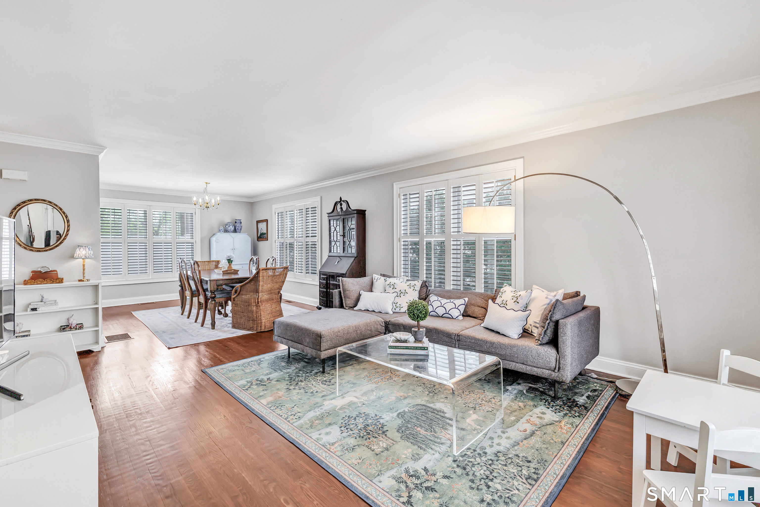 39 Maple Tree Avenue, Unit 15 Stamford, CT 06906 - Photo 2 of 32 a living room with furniture and wooden floor