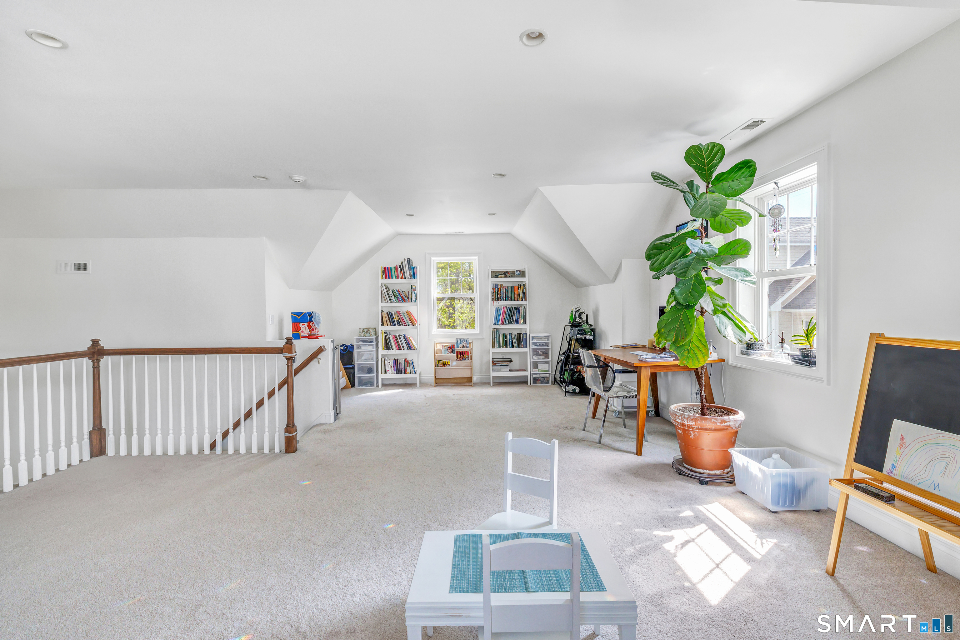 39 Maple Tree Avenue, Unit 15 Stamford, CT 06906 - Photo 22 of 32 a living room with furniture and a potted plant
