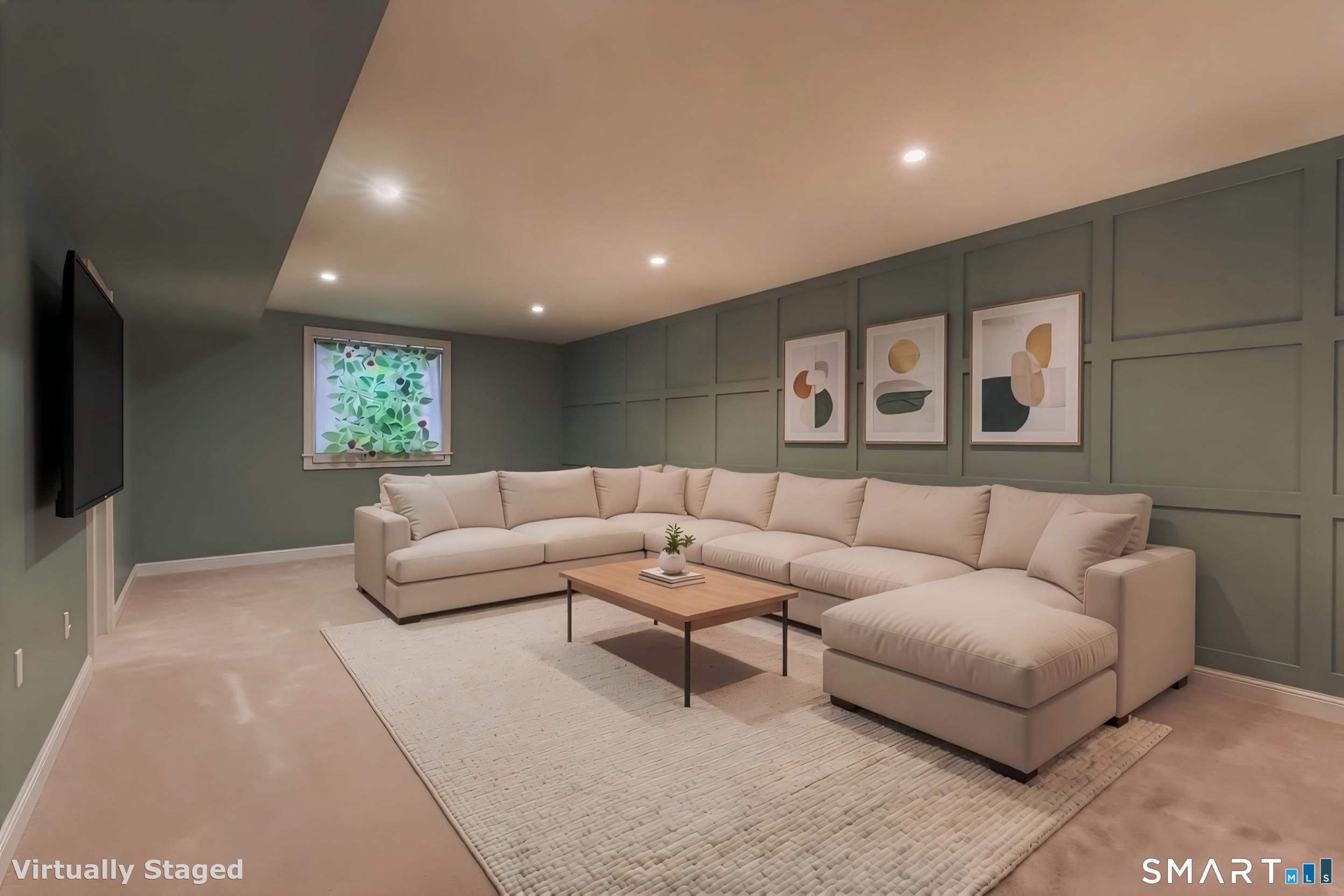 39 Maple Tree Avenue, Unit 15 Stamford, CT 06906 - Photo 26 of 32 a living room with furniture and a flat screen tv