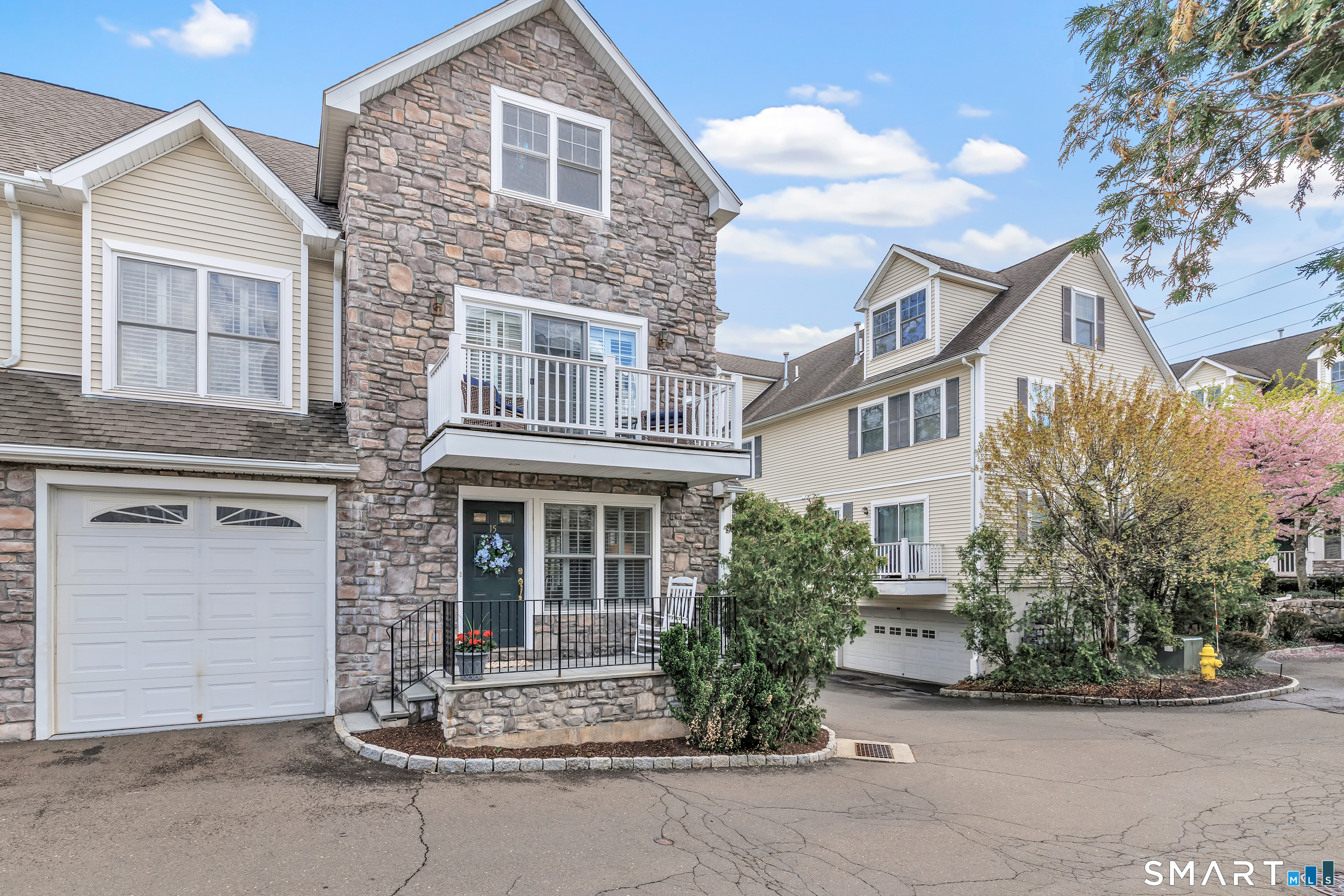 39 Maple Tree Avenue, Unit 15 Stamford, CT 06906 - Photo 27 of 32 front view of house with a yard
