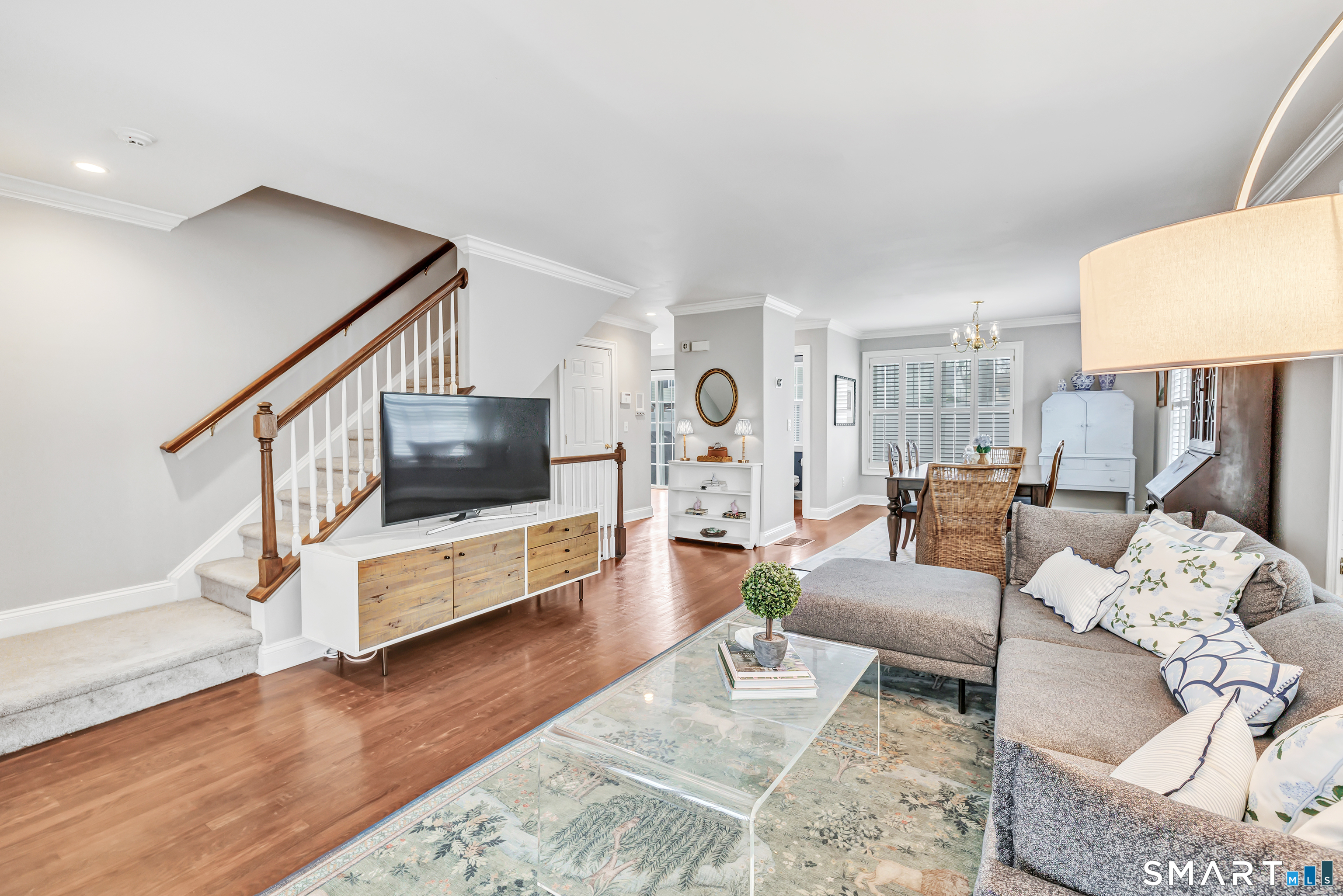 39 Maple Tree Avenue, Unit 15 Stamford, CT 06906 - Photo 5 of 32 a living room with furniture and a flat screen tv