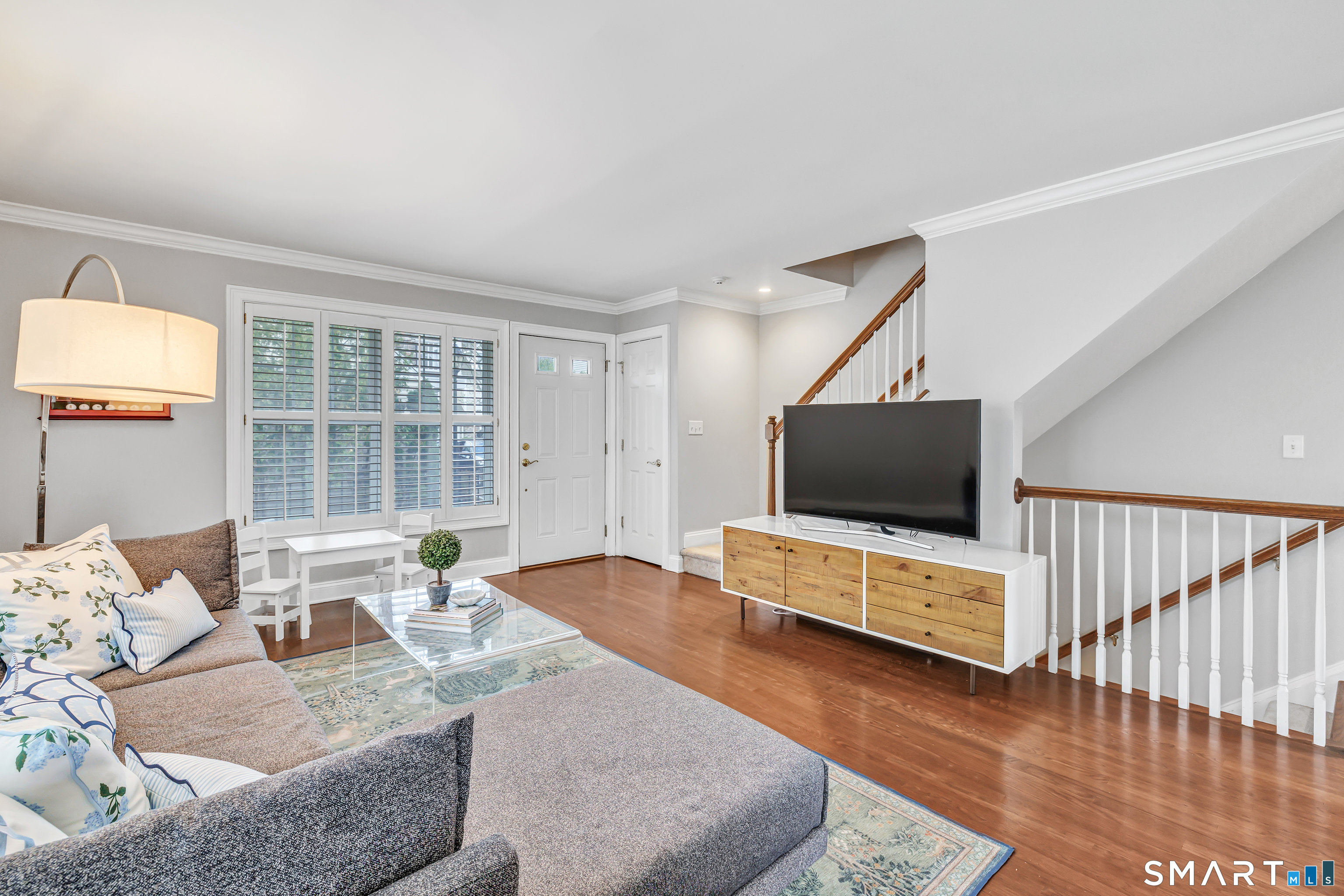 39 Maple Tree Avenue, Unit 15 Stamford, CT 06906 - Photo 7 of 32 a living room with furniture and a flat screen tv
