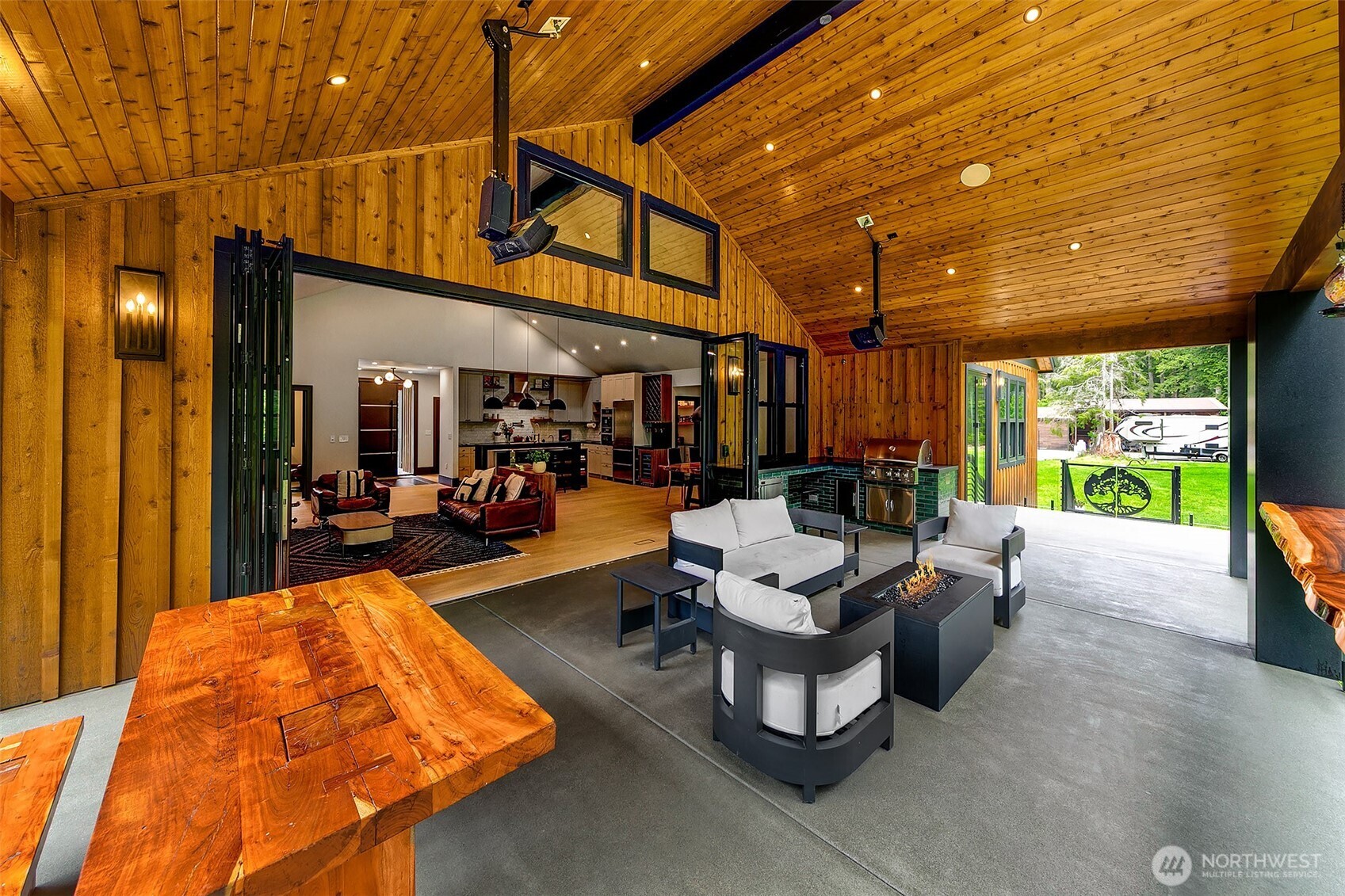 7538 Moon Valley Road Southeast North Bend, WA 98045 - Photo 10 of 40 a living room with patio furniture and a large window