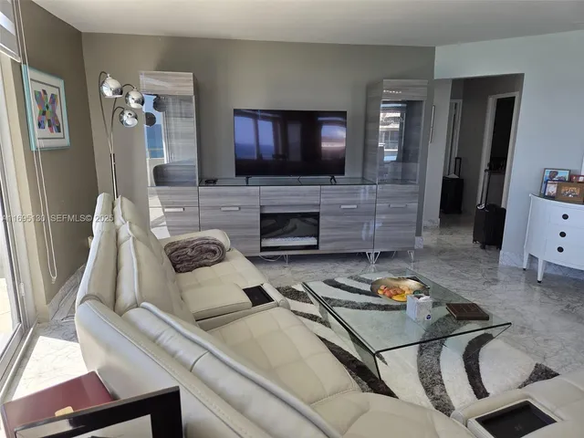 a view of a livingroom with furniture and window