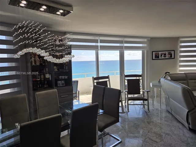 a bed room with a bed and a chandelier